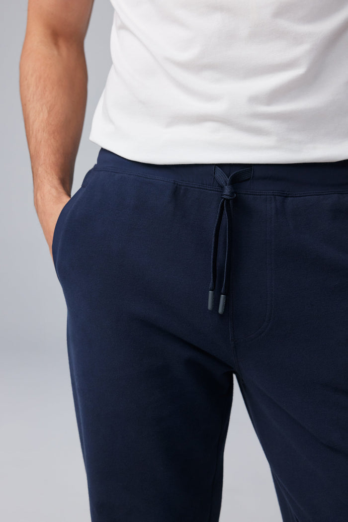 Detail front view of man wearing ACE Straight Leg Sweatpant in Total Eclipse