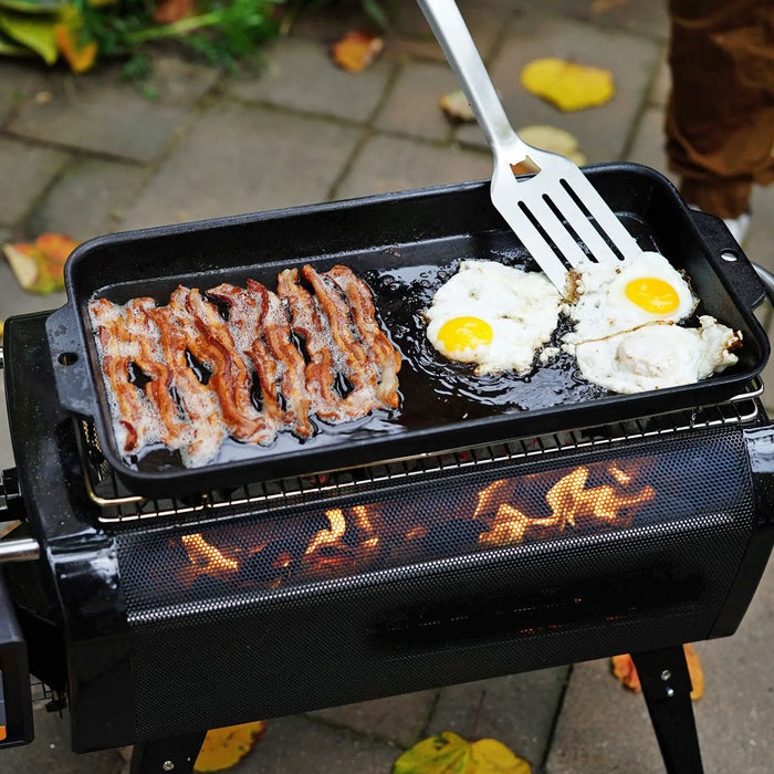 Biolite Firepit+ cast iron griddle pan being used to cook a breakfast