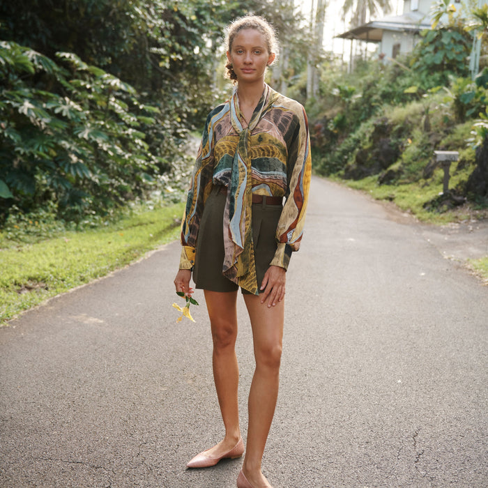 Front image of a woman standing wearing the Fiona Top—Silk Desert in Multicolor