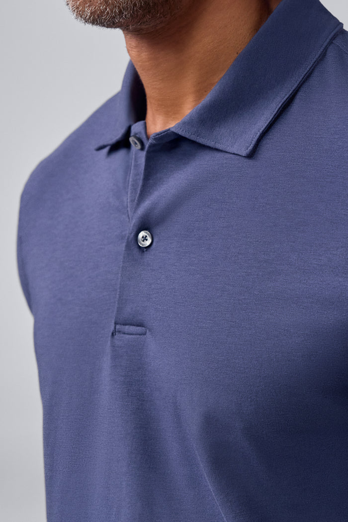 Detailed front view of a man wearing Silver Long Sleeve Polo in True Navy