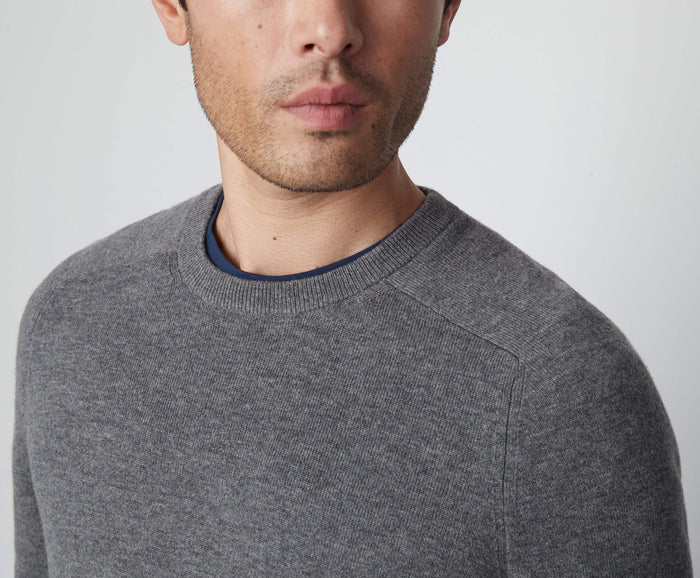 Detailed front view of a man wearing Tech Cashmere Crew Neck Sweater in Graphite Heather