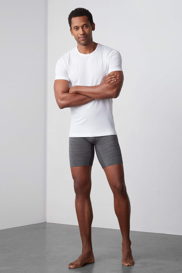 Front view of a man wearing AIRKNITx 8" Boxer Brief in Charcoal Heather