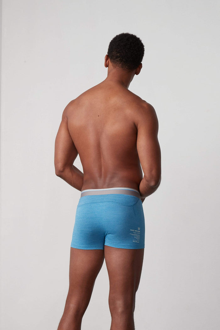 Back view of a man wearing AIRKNITx Trunks in Riptide Heather
