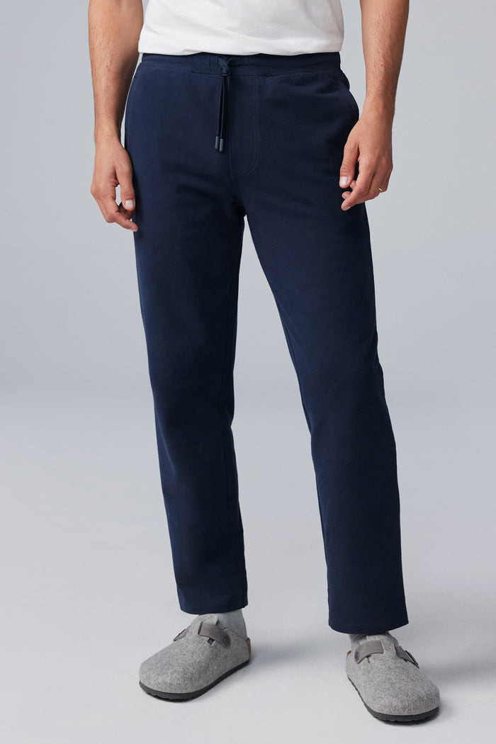 Front view of man wearing ACE Straight Leg Sweatpant in Total Eclipse