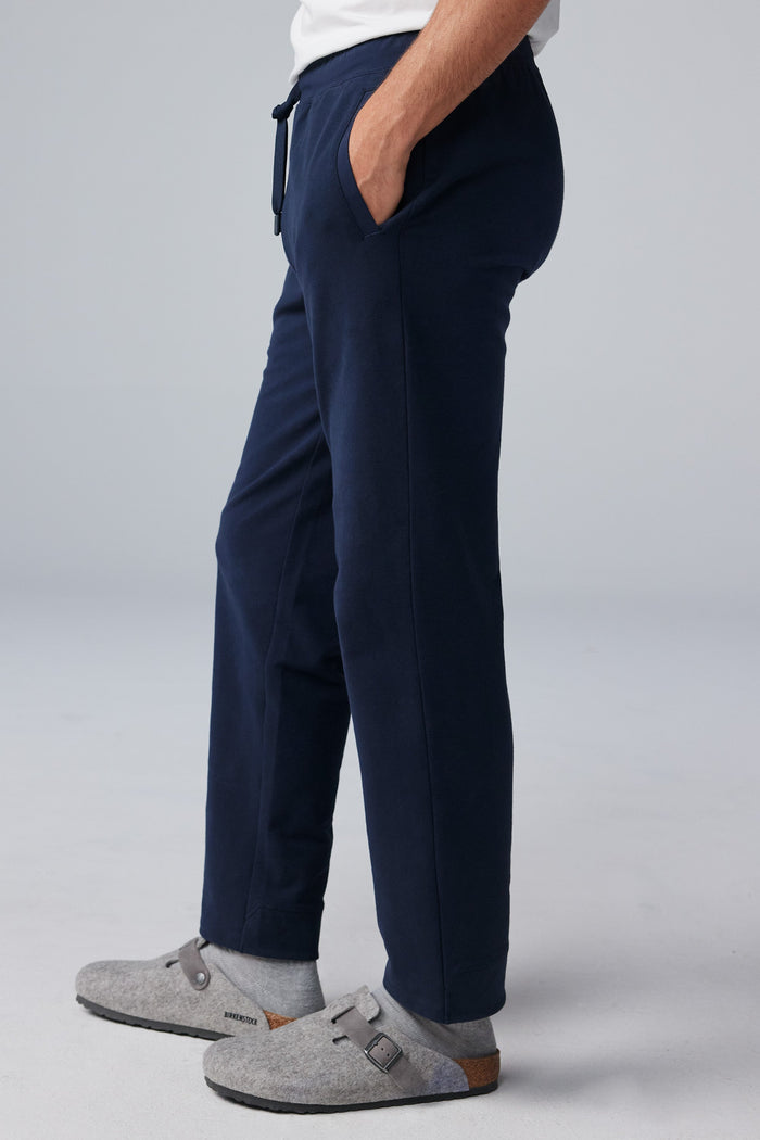 Side view of man wearing ACE Straight Leg Sweatpant in Total Eclipse