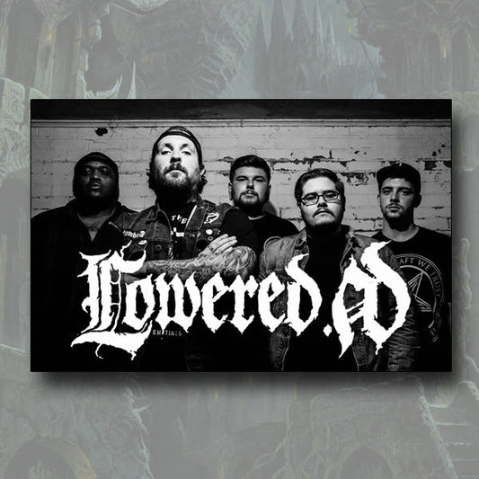 Five men pose in front of a brick wall in a black-and-white image. Bold Lowered A.D. branding is overlaid at the bottom, creating a striking poster effect on the dark, textured background.