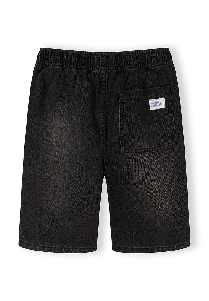 Back view of black denim shorts with elasticated waistband and side pocket.