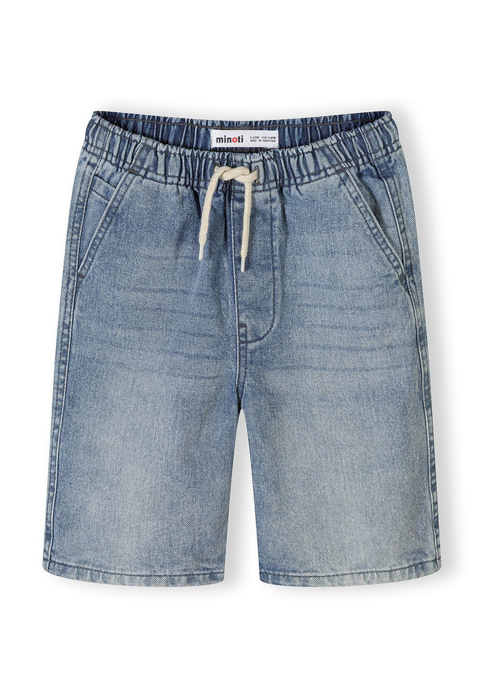 Detail of blue denim shorts with elasticated waistband and side pockets.