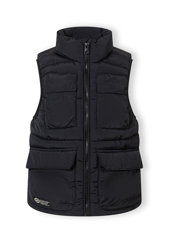 Boys black quilted waistcoat with stand collar, front view, featuring two flap pockets and a full-length zipper.