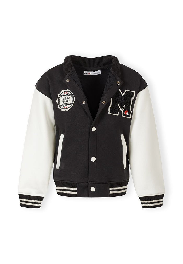 Front view of a boys' lightweight baseball jacket featuring black and white contrast sleeves and patches.