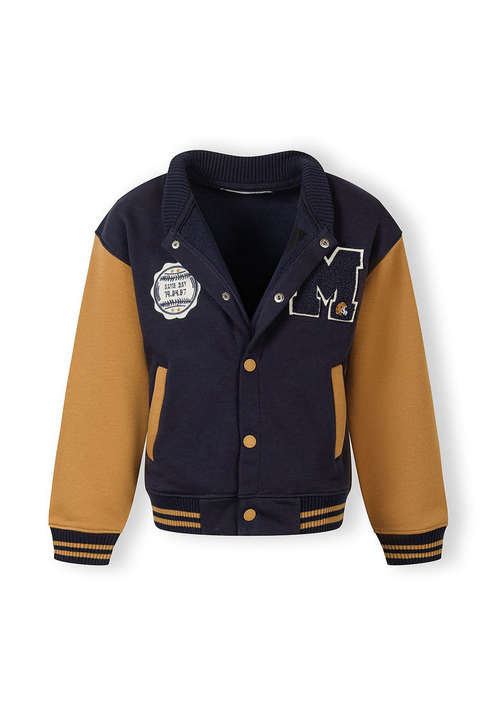 Front view of a boys lightweight navy baseball jacket with contrasting sleeves and logo.