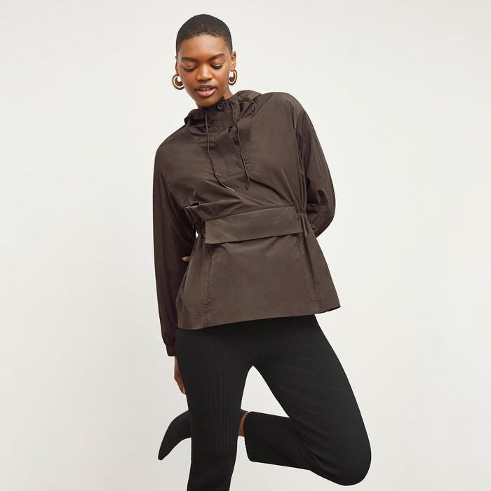 Front image of a woman standing wearing the Britt Hoodie—AirTech in Dark Moss | Lead
