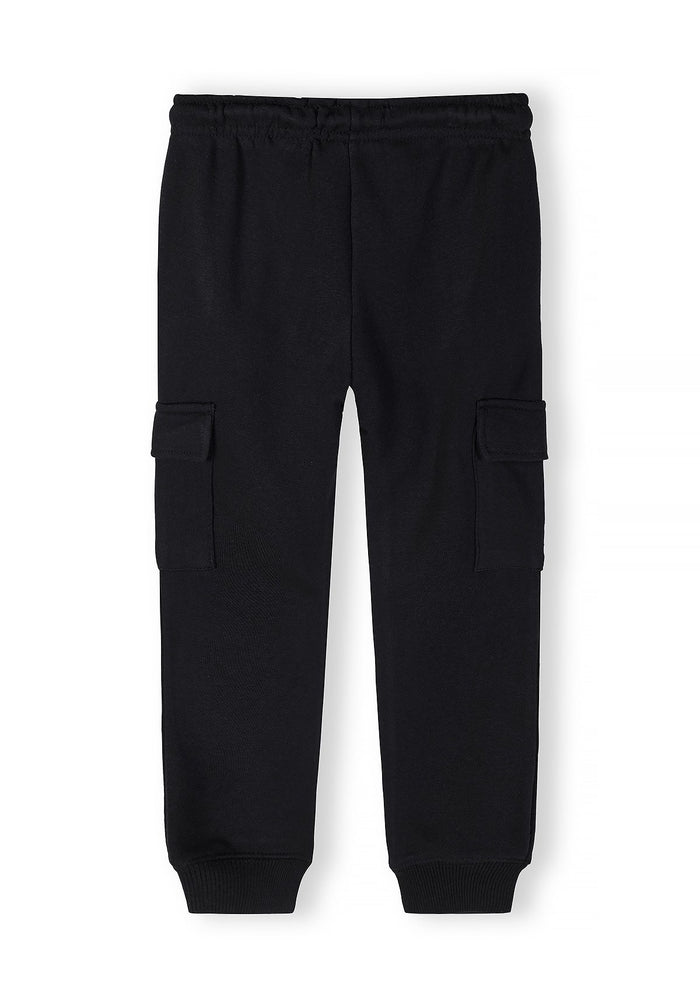 Boys cargo joggers in black, front view with elasticated waistband and cargo pockets.