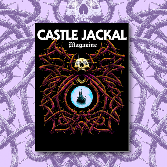 Castle Jackal Magazine Issue #1 showcases a skull over dark thorns encircling a glowing orb with a distant castle, set against purple thorny vines.