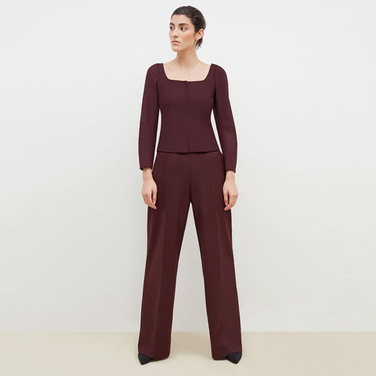 Front image of a woman standing wearing the Dawn Top-Sharkskin in garnet | Lead