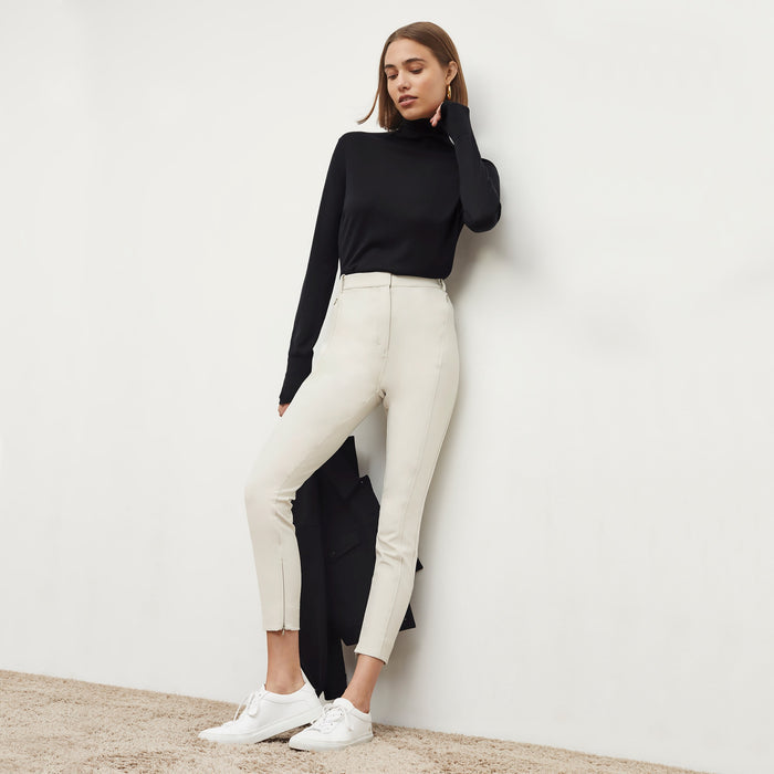 Front image of a woman wearing the elizabeth top in black