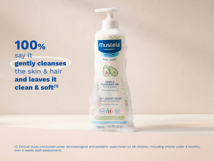 Mustela USA  | Bottle of Mustela Gentle Cleansing Gel with foam on a beige surface.