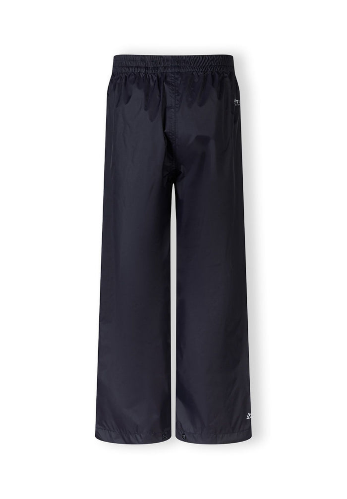 Kids waterproof overpants in navy, back view with elasticated waist and ankle cuffs.