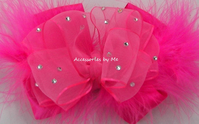 Hot pink hair bow with rhinestones on a white background, branded 'Accessories by Me'.