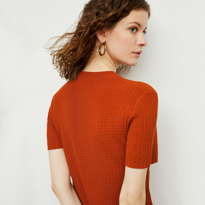 Back image of a woman standing wearing the hayden dress in canyon