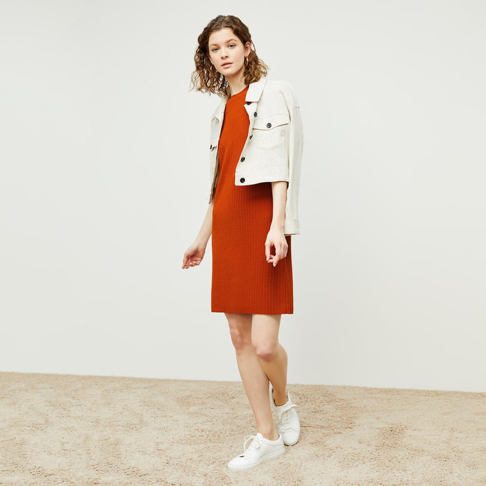 Front image of a woman standing wearing the hayden dress in canyon