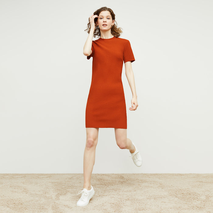 Front image of a woman standing wearing the hayden dress in canyon
