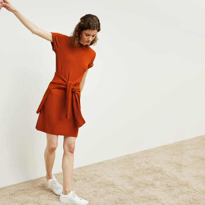 Front image of a woman standing wearing the hayden dress in canyon