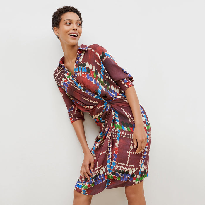 Front image of a woman standing wearing the june dress dash plaid in multicolor