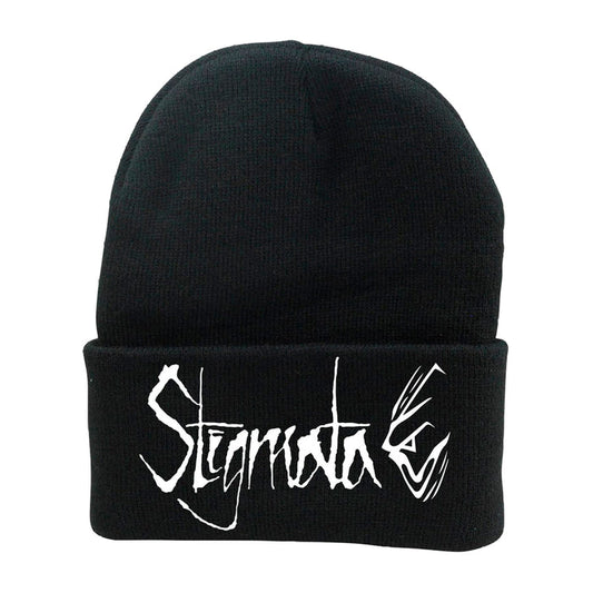 The Stigmata black knit beanie features bold, white, stylized jagged Stigmata lettering on the front fold.