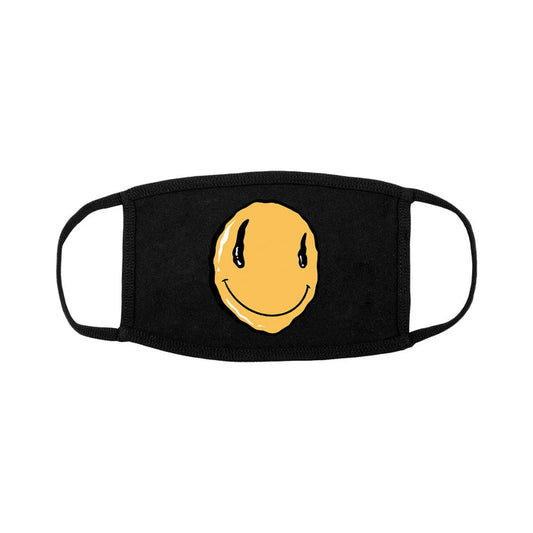 The Dreamer Development Group black face mask features a yellow smiley face with black teardrops at the center. For lasting quality, hand wash and air dry.