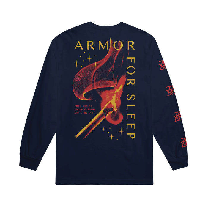 Navy blue Armor For Sleep long-sleeve tee featuring yellow band text, a bold red and yellow match flame graphic, and THE LIGHT WE FOUND IT BURNS UNTIL THE END. Red symbols run along the 100% cotton sleeves.