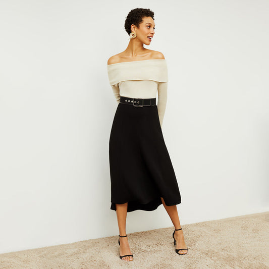 Front image of a woman standing wearing the Melrose Skirt in Black | Lead