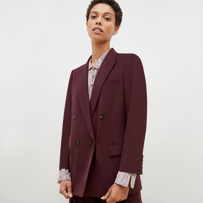 Detail image of a woman standing wearing the O'Hara Blazer-Sharkskin in garnet