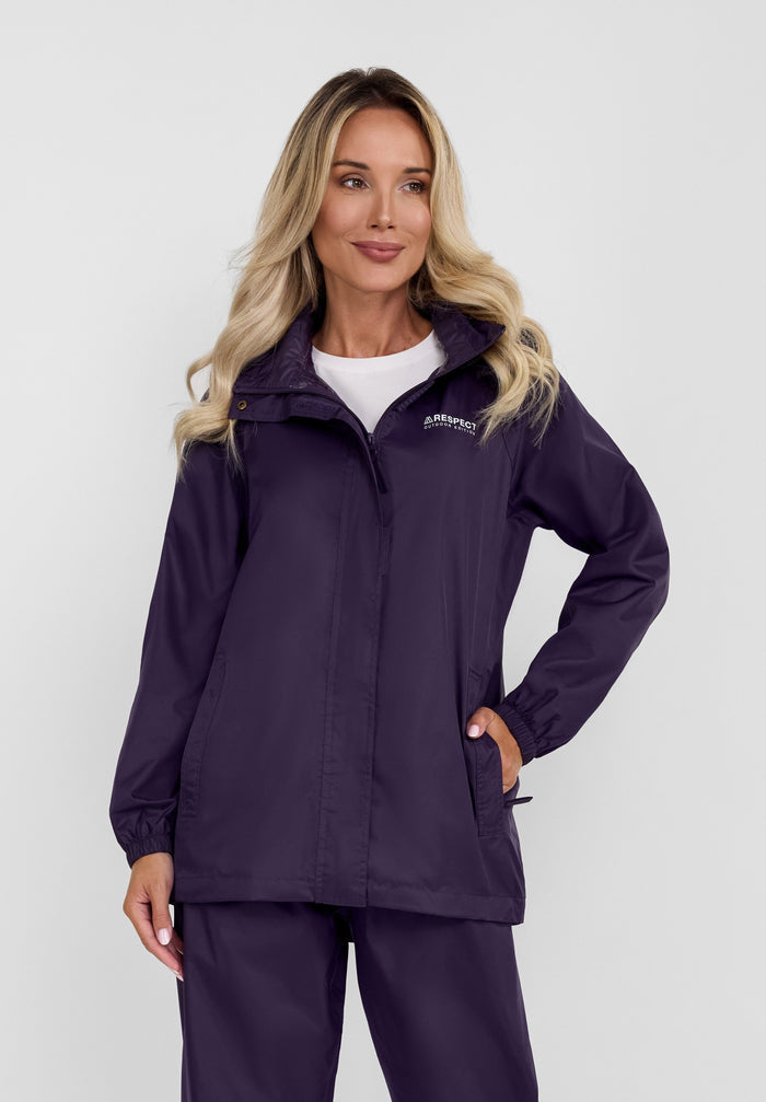 Front view of a women's purple packaway waterproof jacket with a hood and zipped pockets.