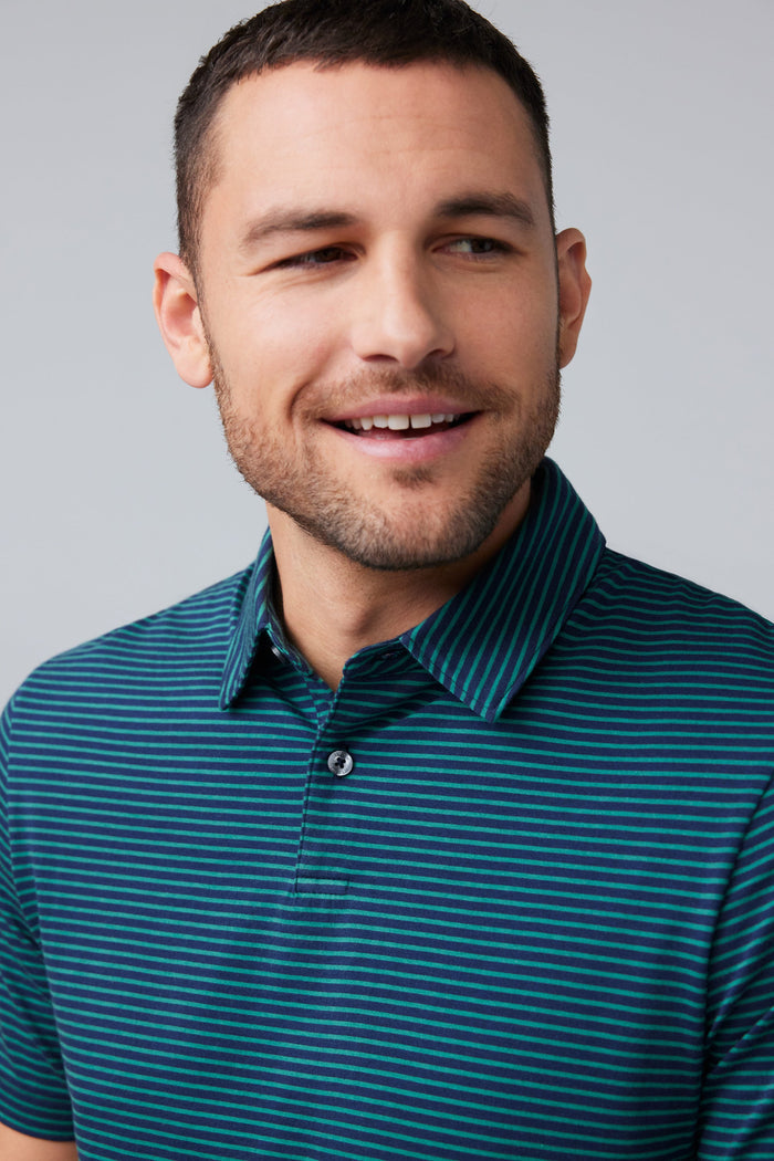 Close-up front view of a man wearing Pima T-Shirt Polo in True Navy Pinpoint Stripe