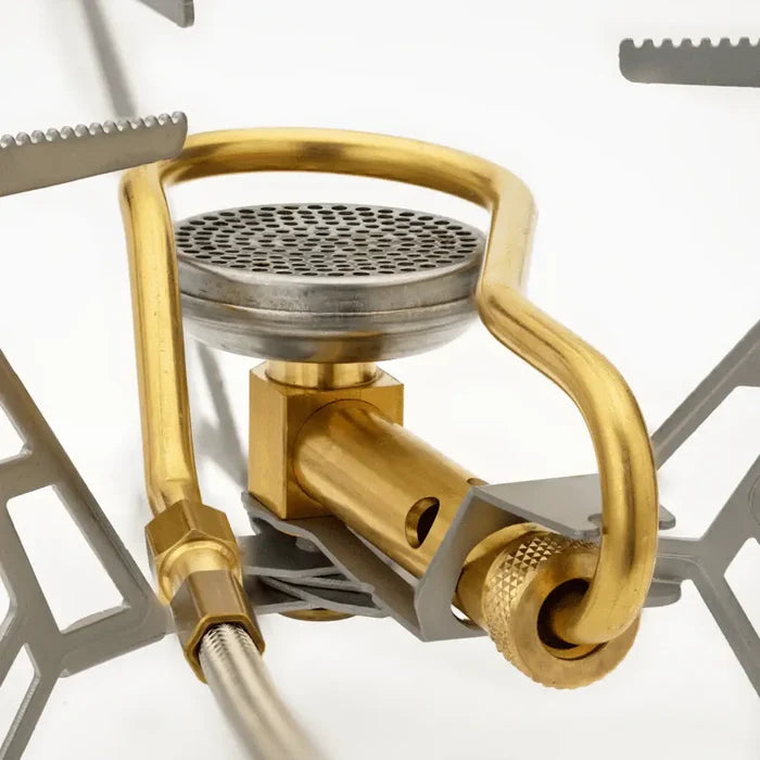 Close-up of the burner and pre-heating coil on a Primus Express Spider Camping Gas Stove on a white background