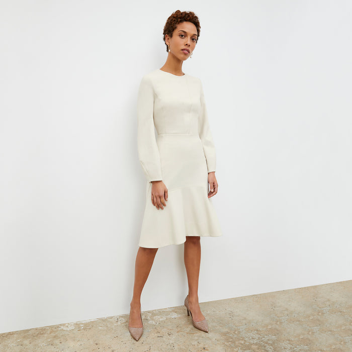 Front image of a woman standing wearing the rashida top in pearl | Lead