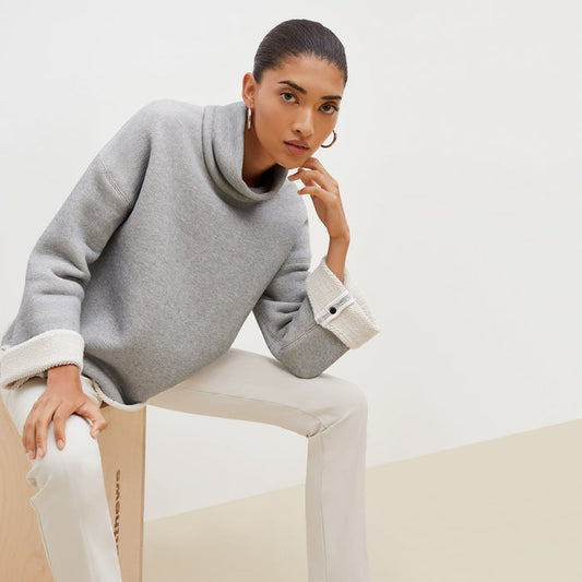 Front image of a woman sitting wearing the Sharon Top—Plush Terry in Gray / Ivory | Lead