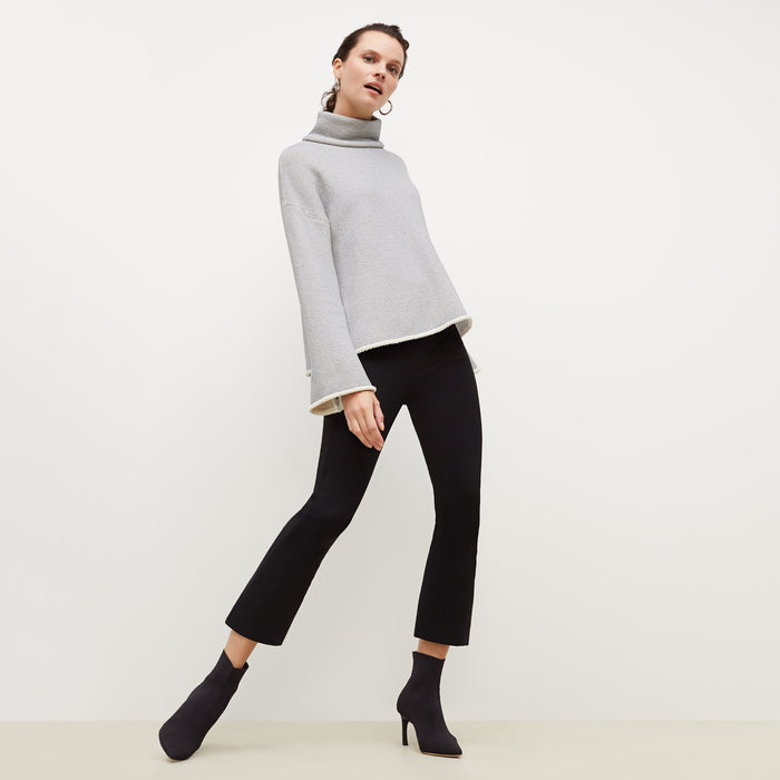 Front image of a woman standing wearing the Sharon Top—Plush Terry in Gray / Ivory