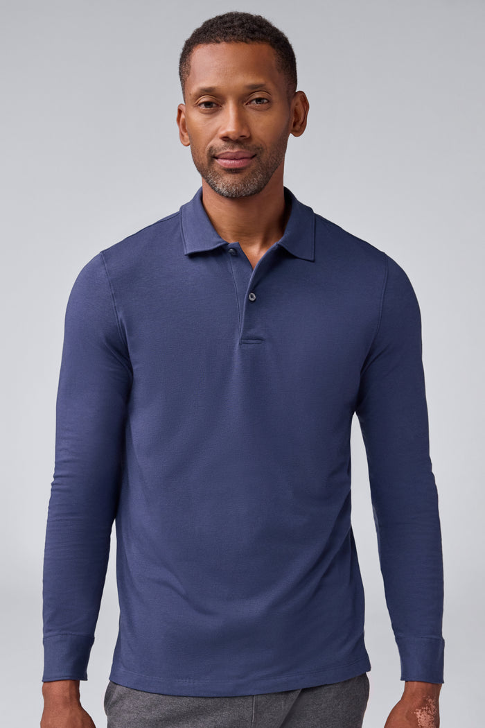 Front view of a man wearing Silver Long Sleeve Polo in True Navy