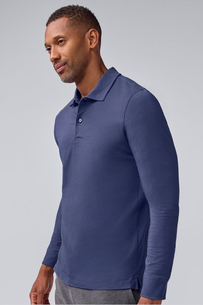 Side view of a man wearing Silver Long Sleeve Polo in True Navy