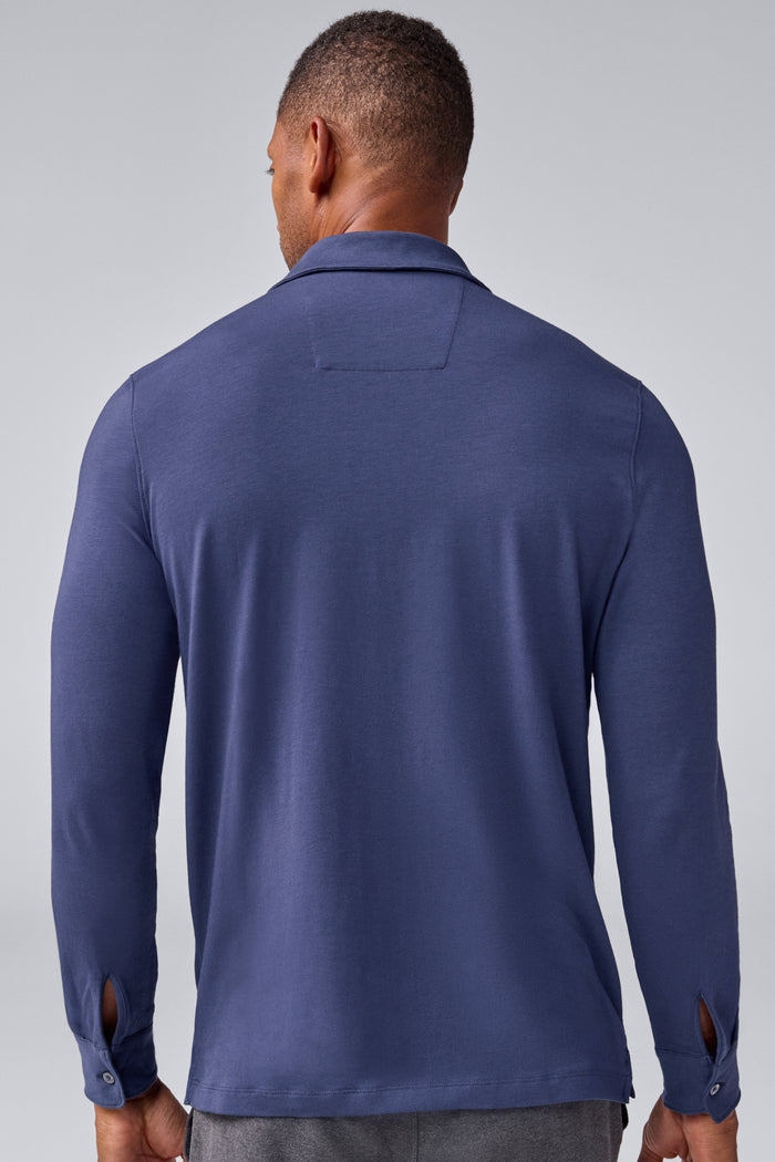 Back view of a man wearing Silver Long Sleeve Polo in True Navy