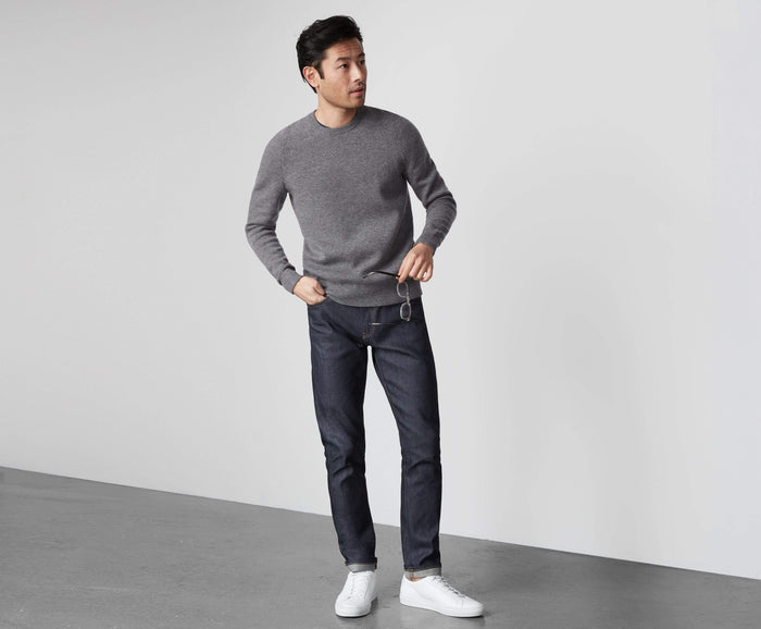 Full body front view of a man wearing Tech Cashmere Crew Neck Sweater in Graphite Heather