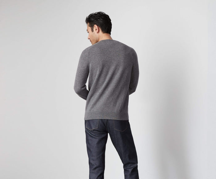 Back view of a man wearing Tech Cashmere Crew Neck Sweater in Graphite Heather