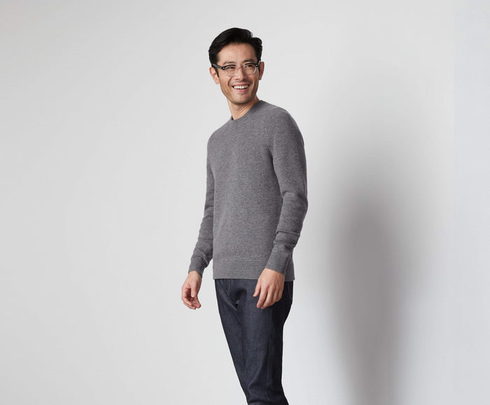 Front view of a man wearing Tech Cashmere Crew Neck Sweater in Graphite Heather