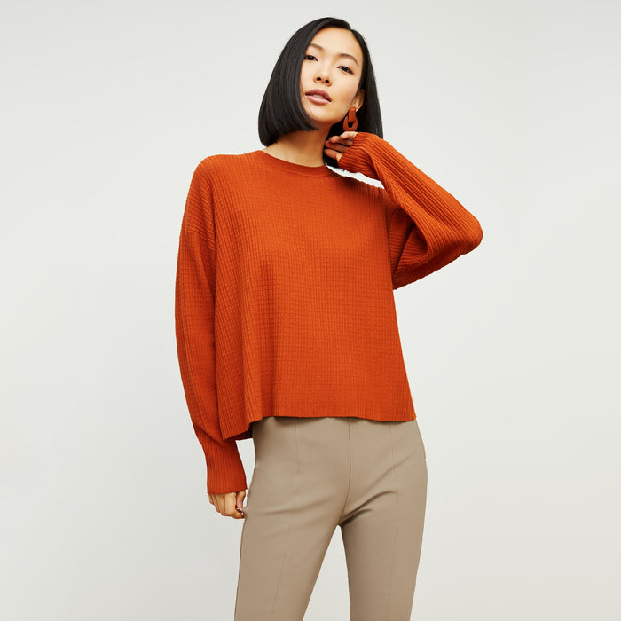 Front image of a woman standing wearing the tyler sweatshirt in canyon | Lead