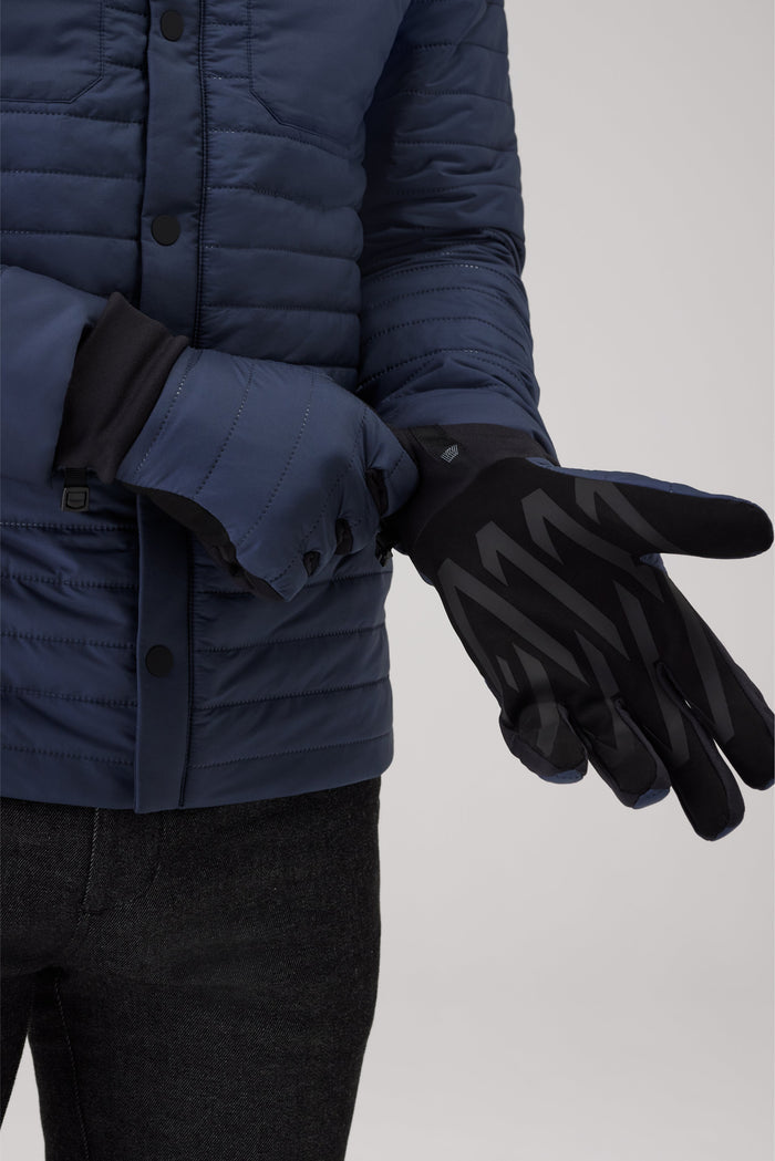 Close up of a man putting on Warmknit Air Performance Glove