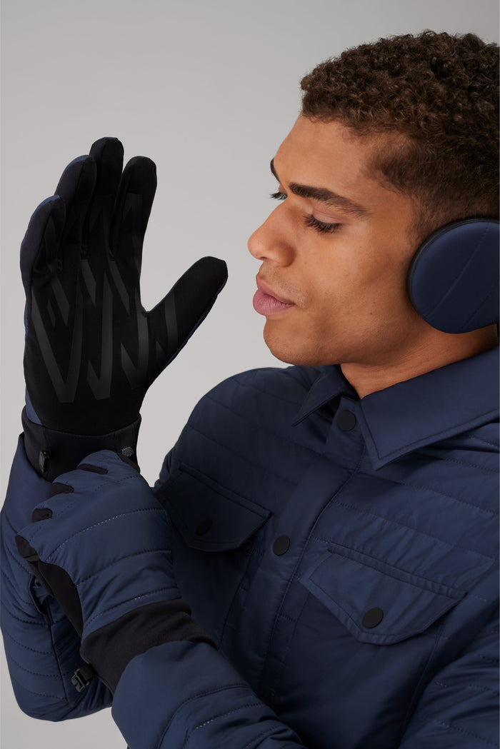 Close up of a man putting on Warmknit Air Performance Glove