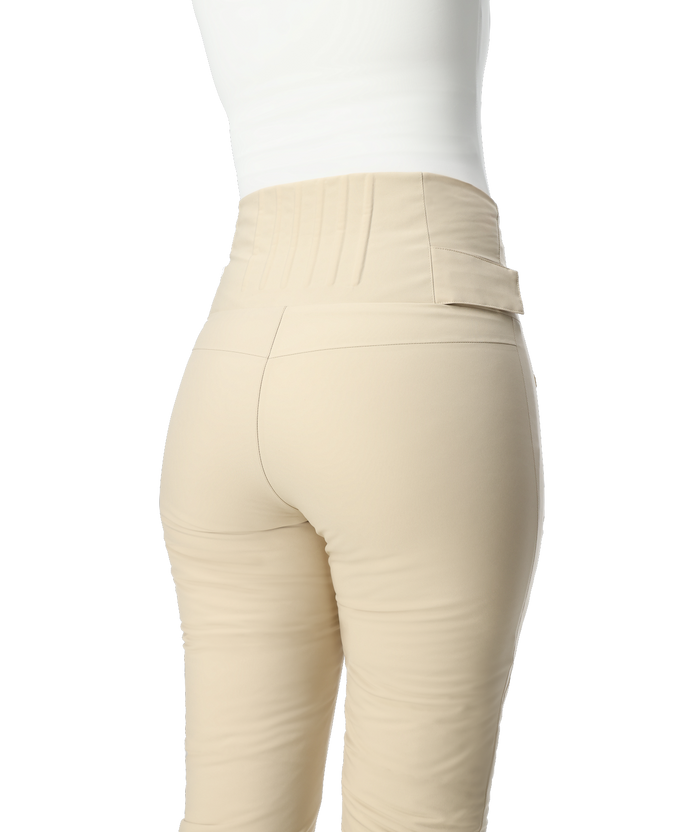 Beige pants worn by a person on a white background