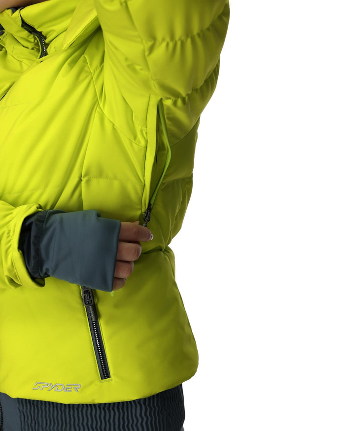 Person wearing a bright yellow jacket with a close-up of the chest area on a white background.